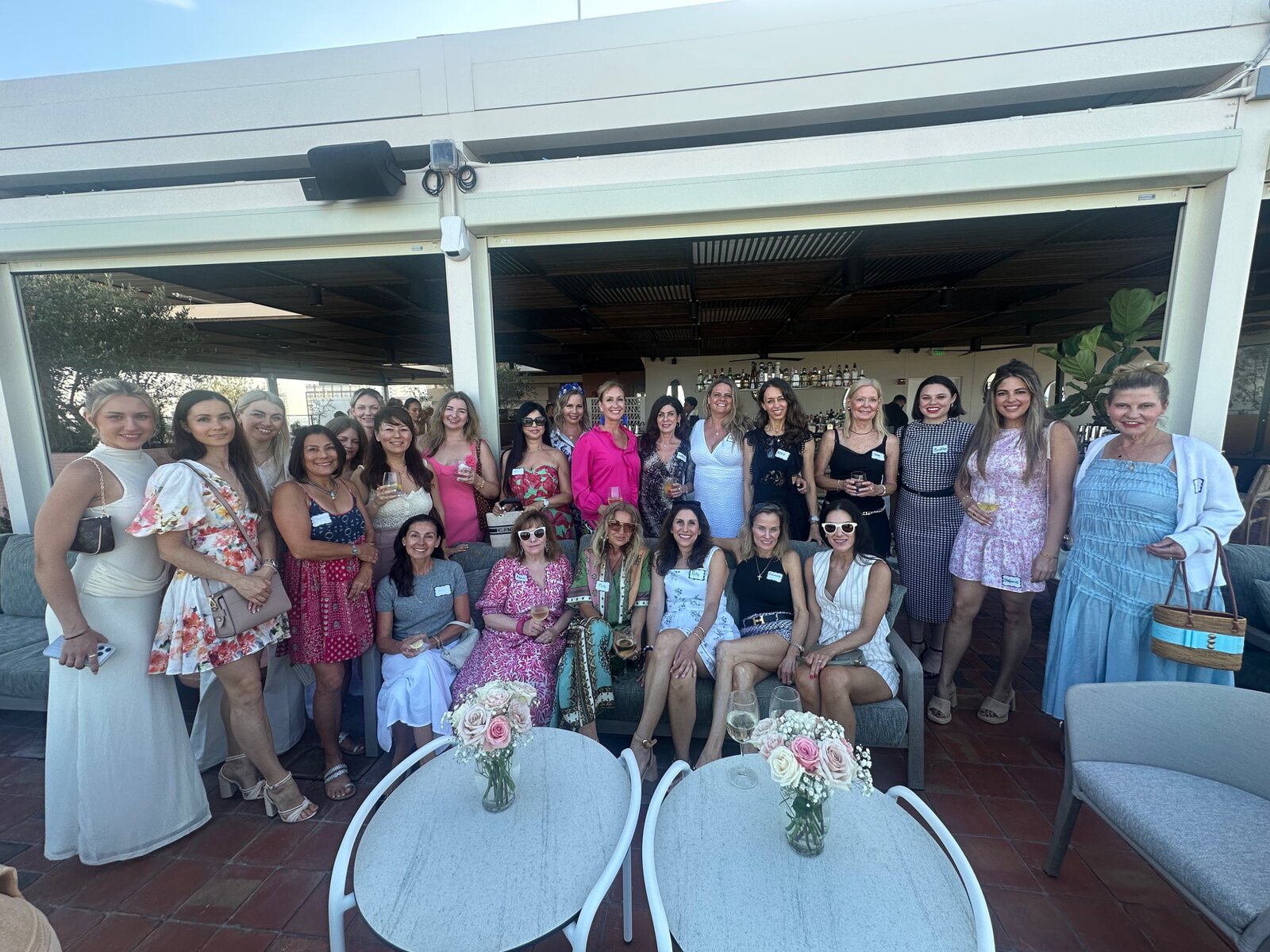The founding gathering — women on the rooftop in Palm Beach